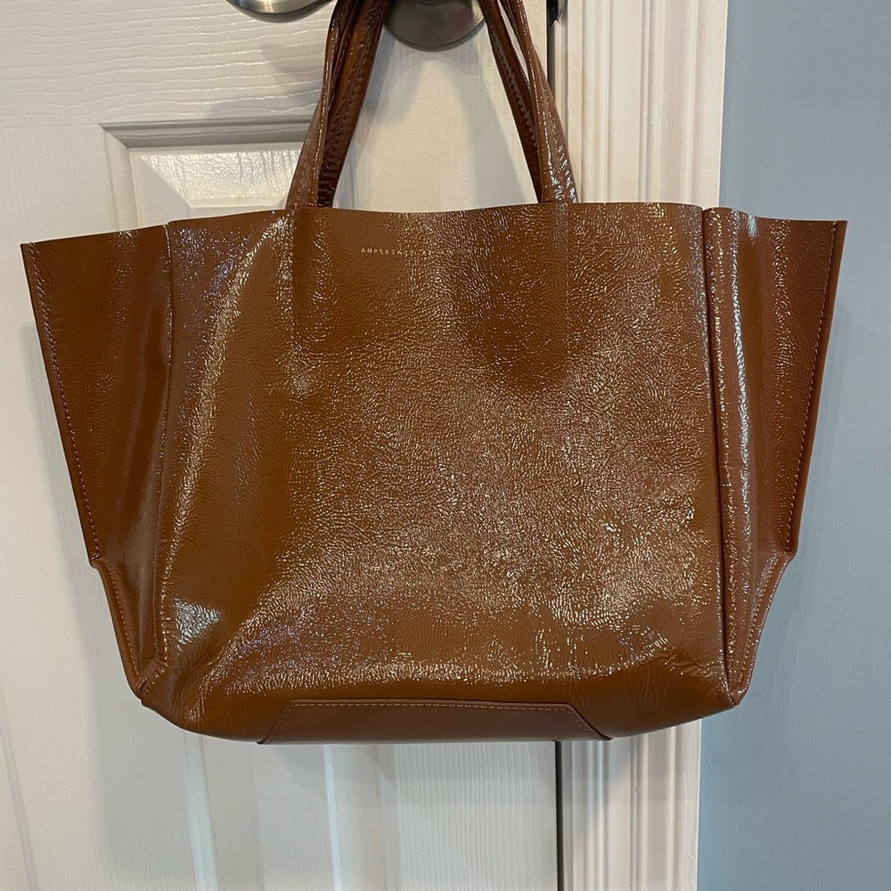 Ampersand and Apostrophe shiny brown leather bag with small snap in zipper pouch